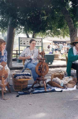 Spinning demonstration in museum courtyard